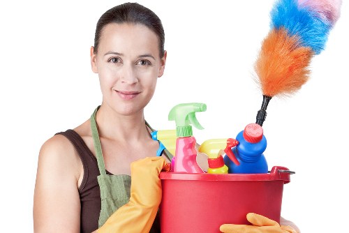 Professional upholstery cleaning process on a fabric sofa